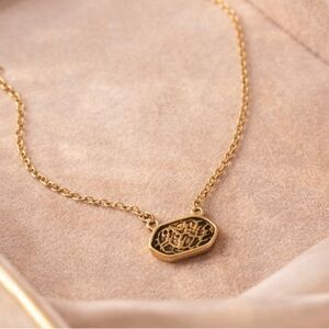 Gold Necklace with Intricate Pendant Design